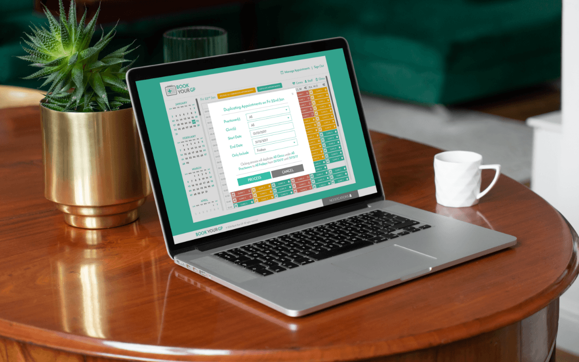 A laptop showcasing the Book Your GP app.